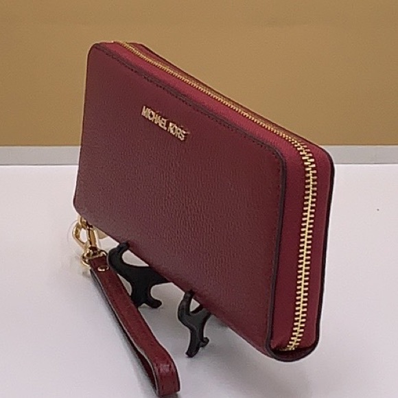 MICHAEL KORS
Leather Continental Wristlet Phone Case Wallet 
Oxblood 
NWT - Picture 14 of 16